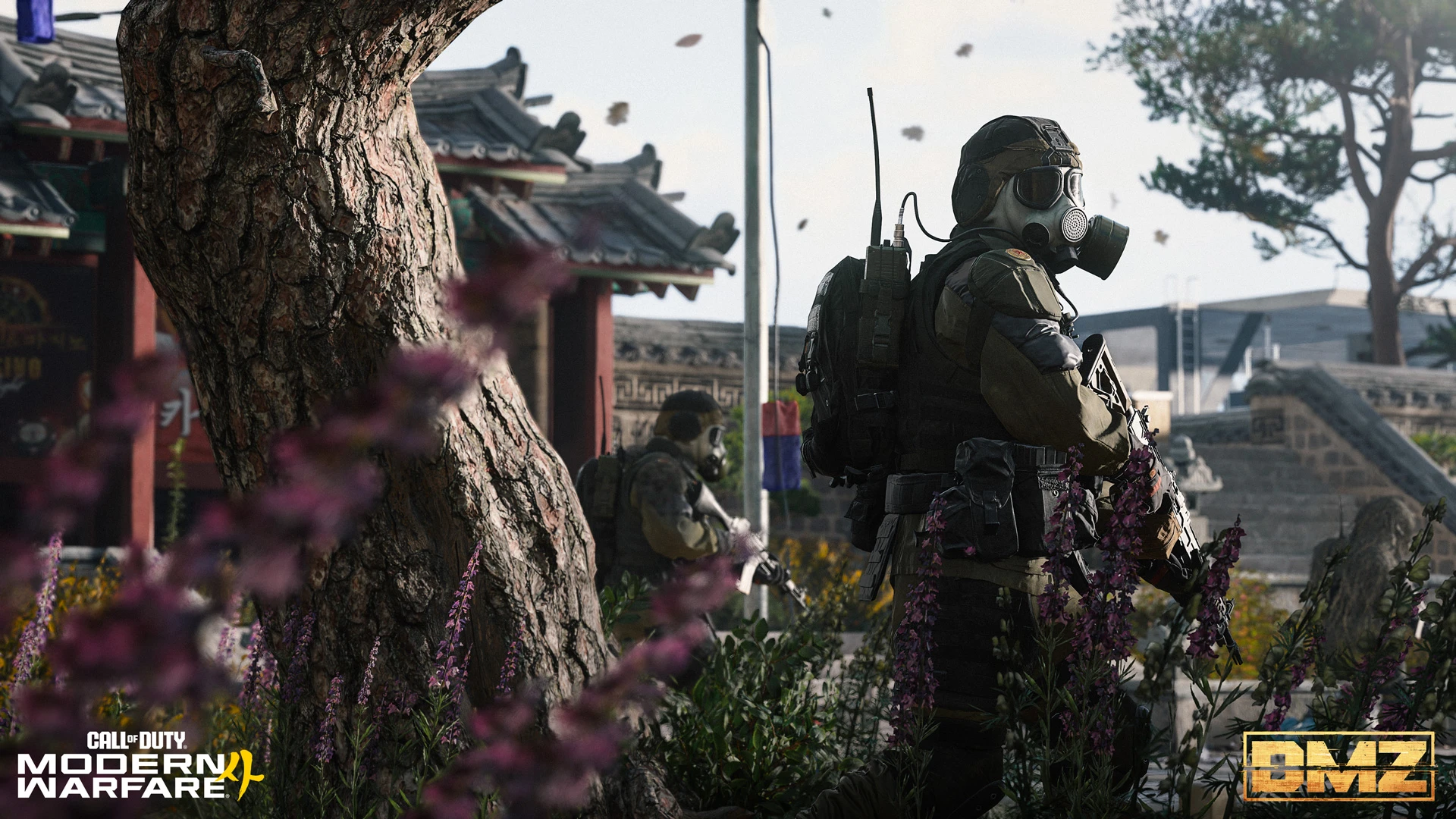 Gas-masked soldiers patrol among trees and buildings in Hajin.